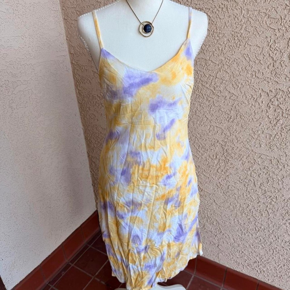 Yellow + purple tie-dye mini dress with spaghetti straps and a flowy fit